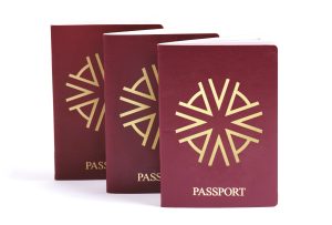 Three passports with Astons' logo on the front depicting dual citizenship