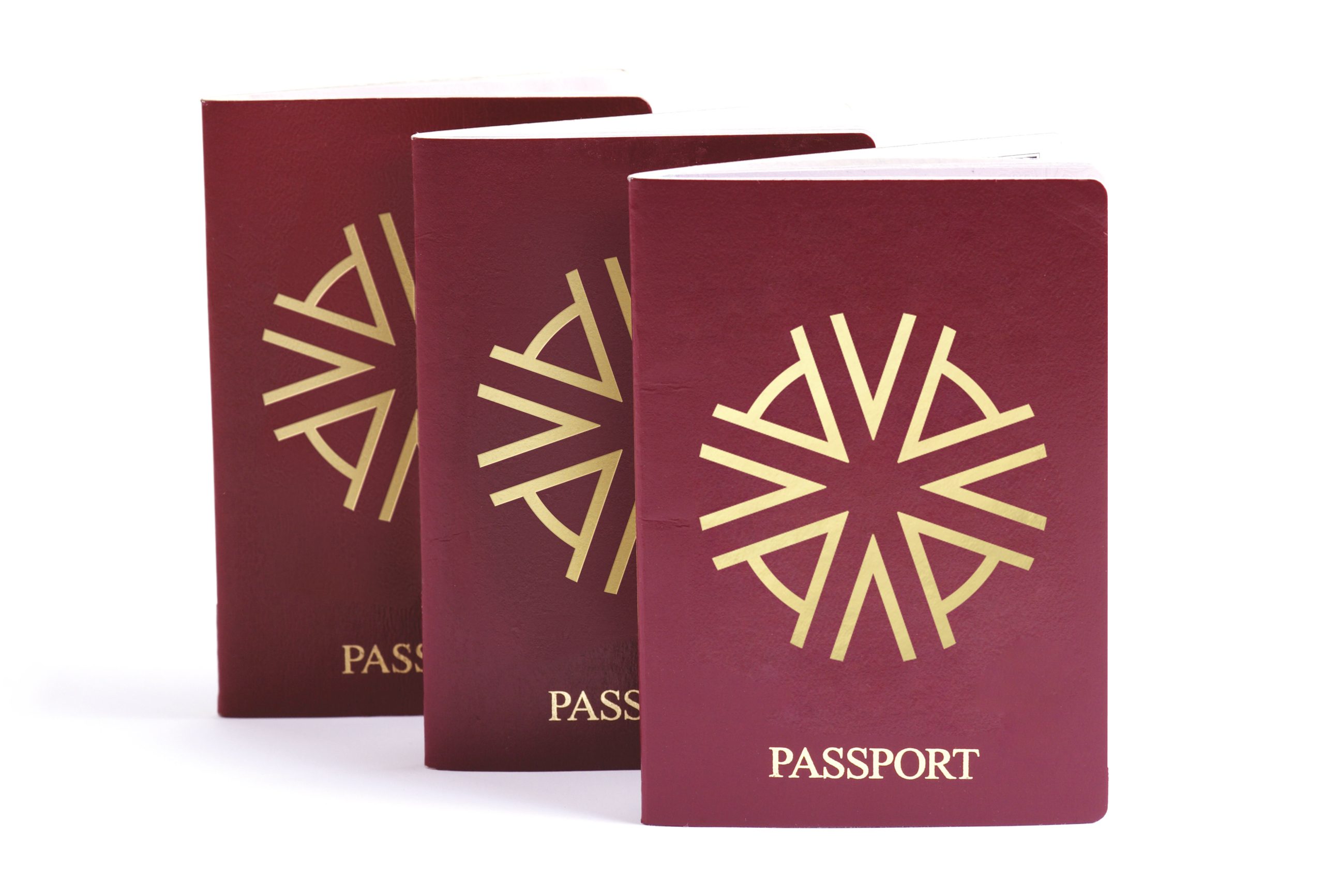 Three passports with Astons' logo on the front depicting dual citizenship