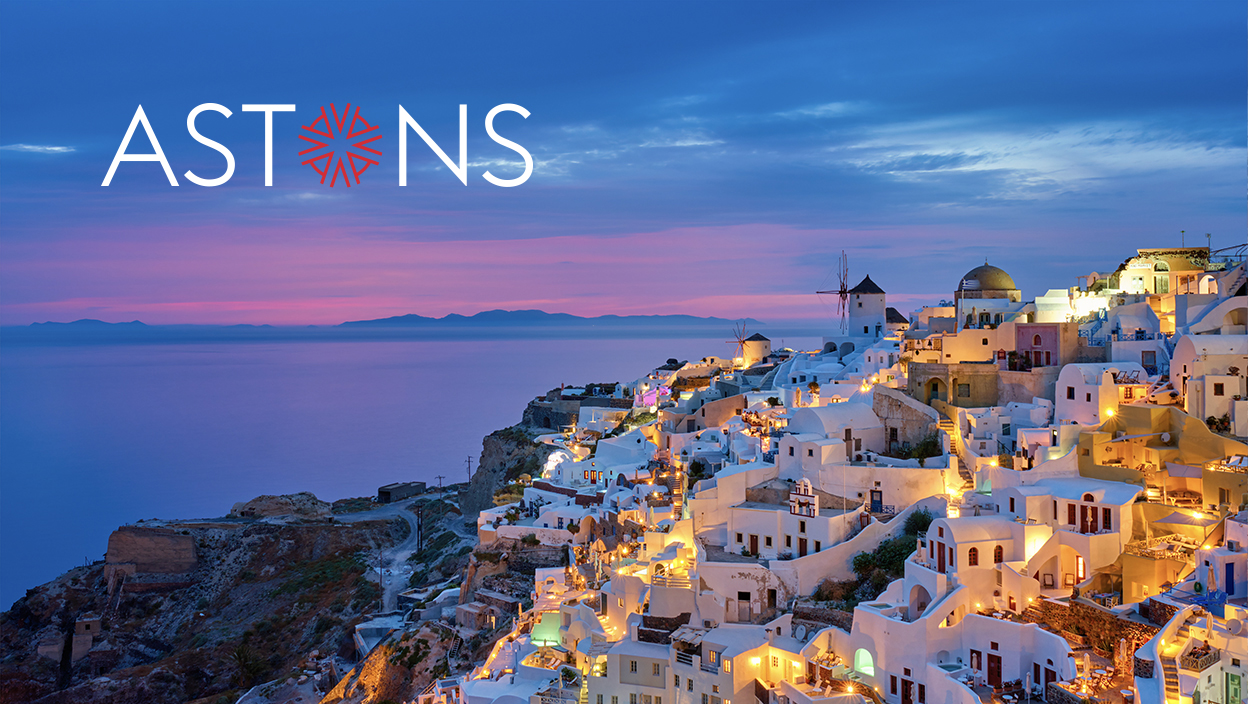 greek hillside properties at dusk